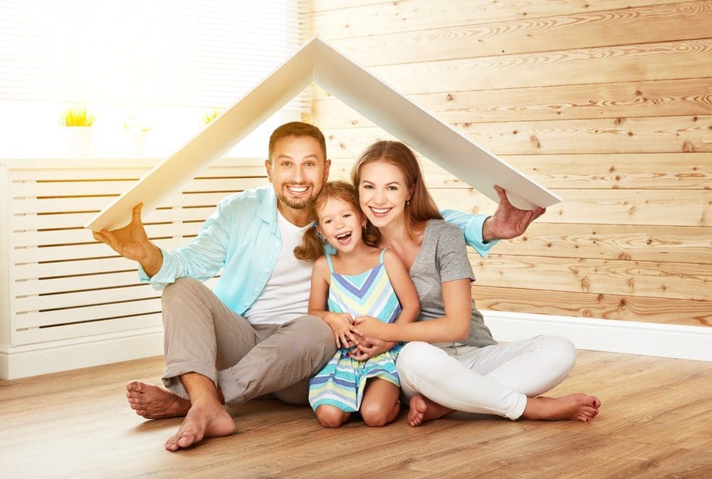 Concept,Housing,A,Young,Family.,Mother,Father,And,Child,In