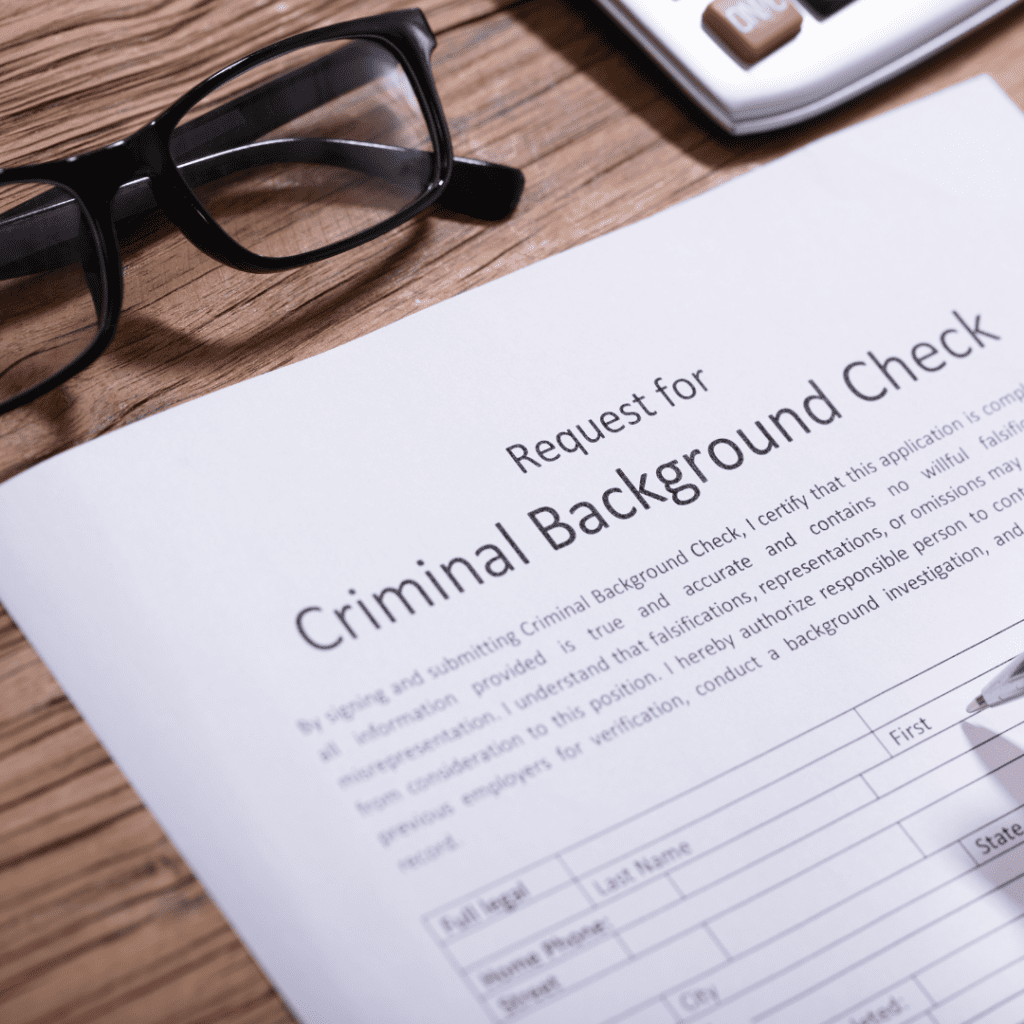 A paper reading "Criminal Background Check"