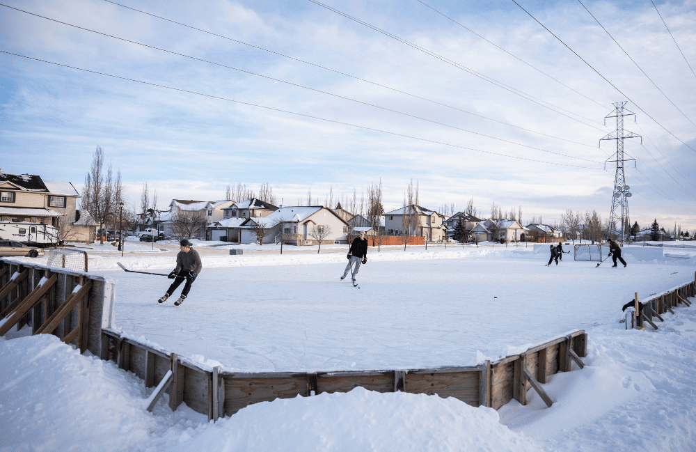 A game of ice hockey takes place on a local Chestermere ice rink